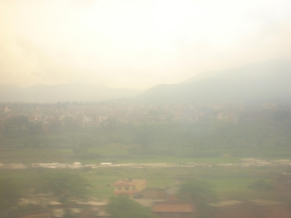 Not too clear- a pic of Nepal taken from the flight