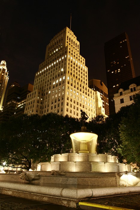 A water fountain infront of Famous Plaza Hotel (not seen in picture)
