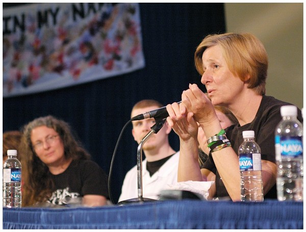 "Military Mom" Cindy Sheehan pleads to Canadian to grant asylum to the Iraq War deserters of the US Armed Forces. She was speakingat University of Toronto on May 3, 2006. The man in the white shirt is a US Marine who deserted US Forces