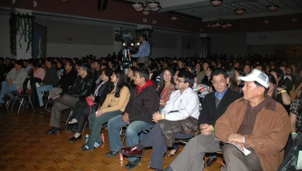 Crowd waits as the keyboard malfunctions - delaying the start of the concert. 