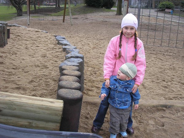 A kid who wants to be photographed and an innocent child who doesn't care